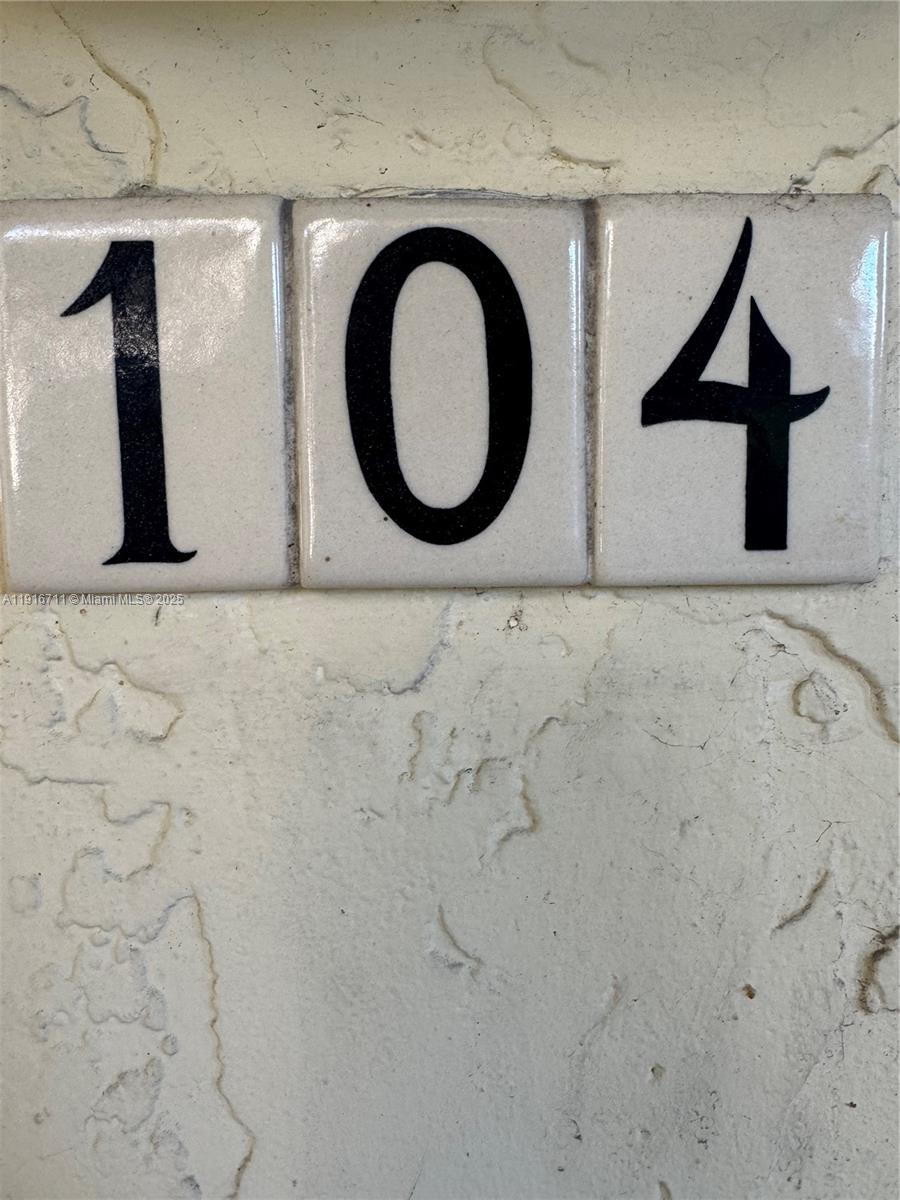 5839 Southwest 74th Terrace, Unit 104 South Miami, FL 33143 - Photo 15 of 25 a bathroom with a toilet and a sink