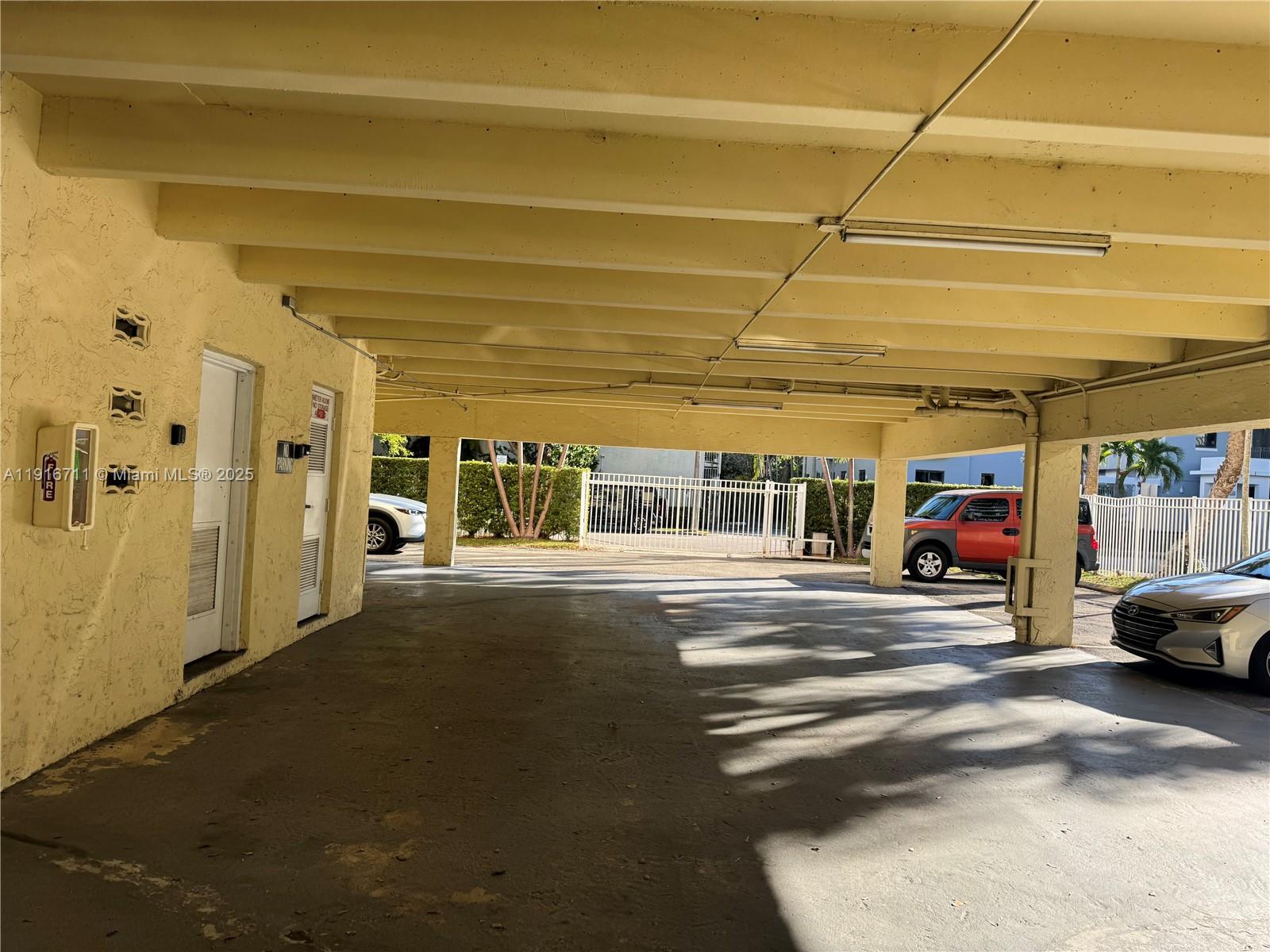 5839 Southwest 74th Terrace, Unit 104 South Miami, FL 33143 - Photo 22 of 25 a view of parking area