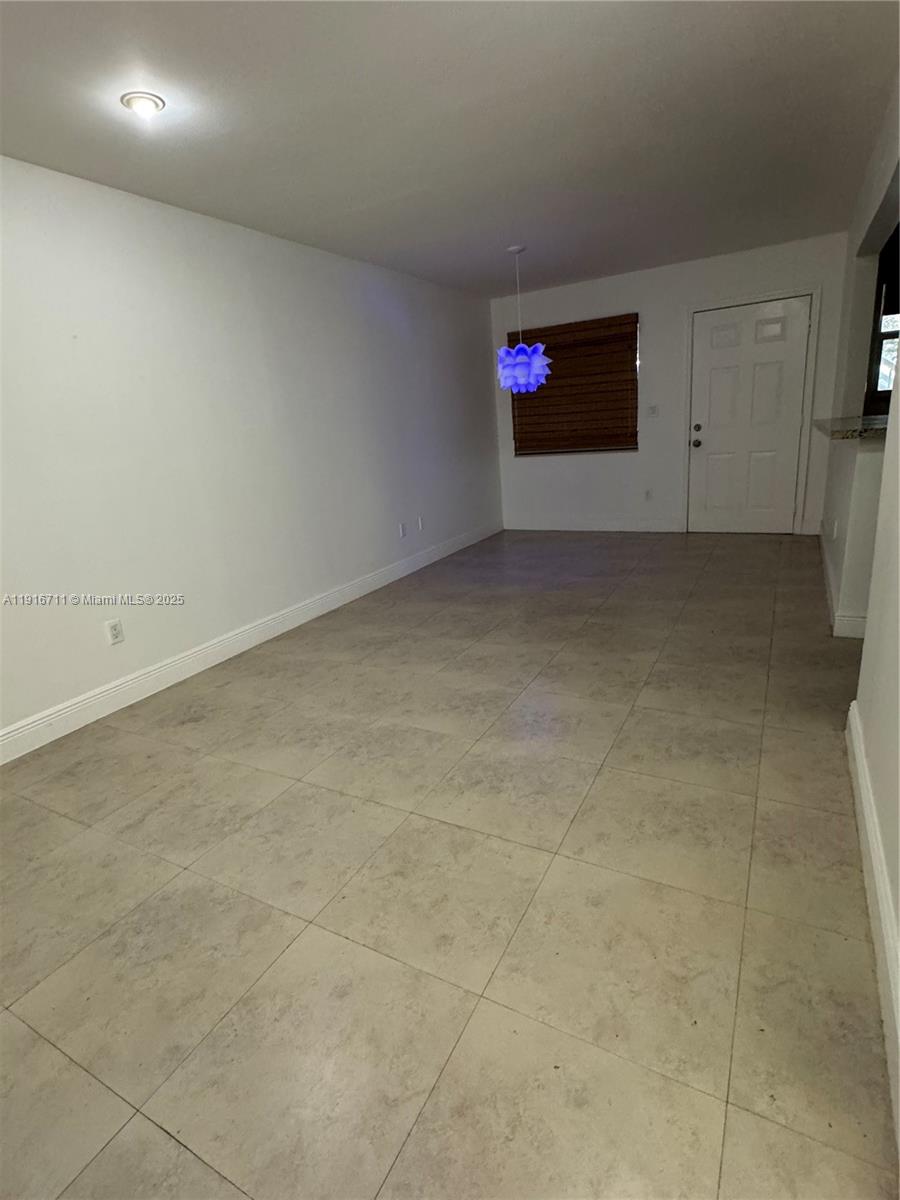 5839 Southwest 74th Terrace, Unit 104 South Miami, FL 33143 - Photo 6 of 25 a view of an empty room