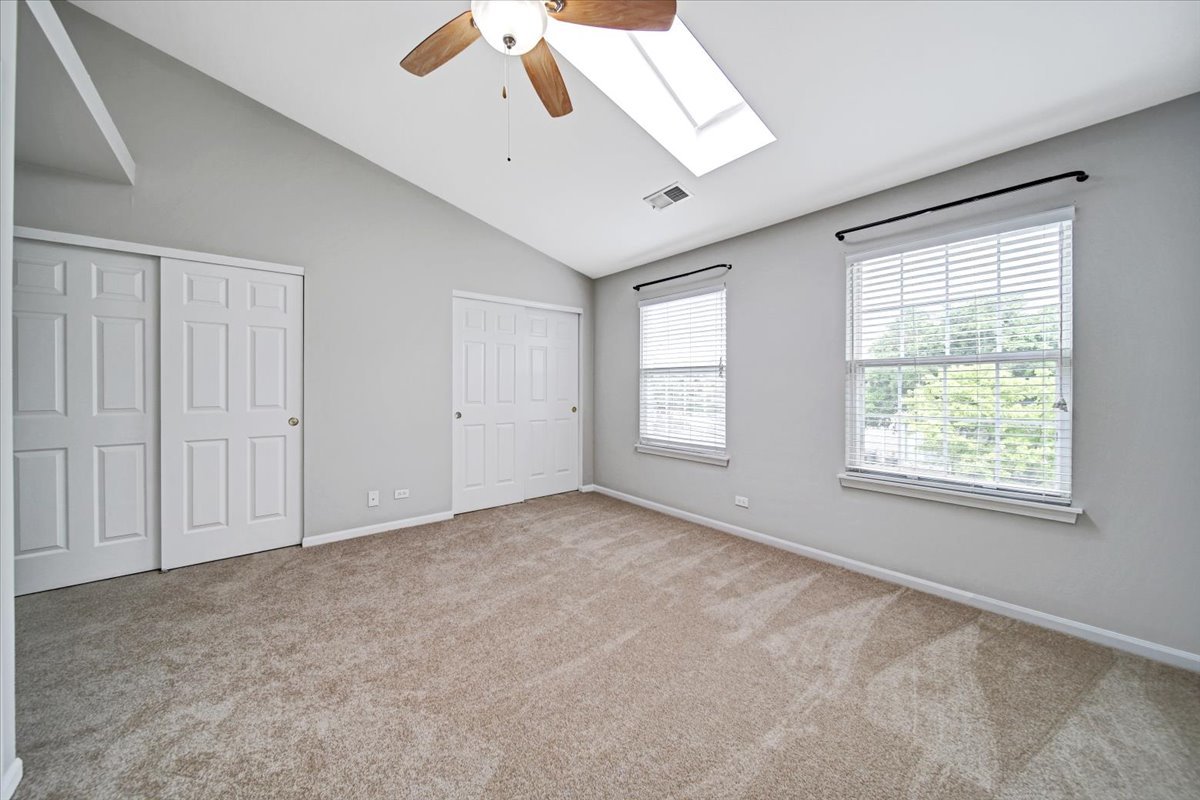 351 Fallbrook Court Schaumburg, IL 60107 - Photo 12 of 29 an empty room with windows