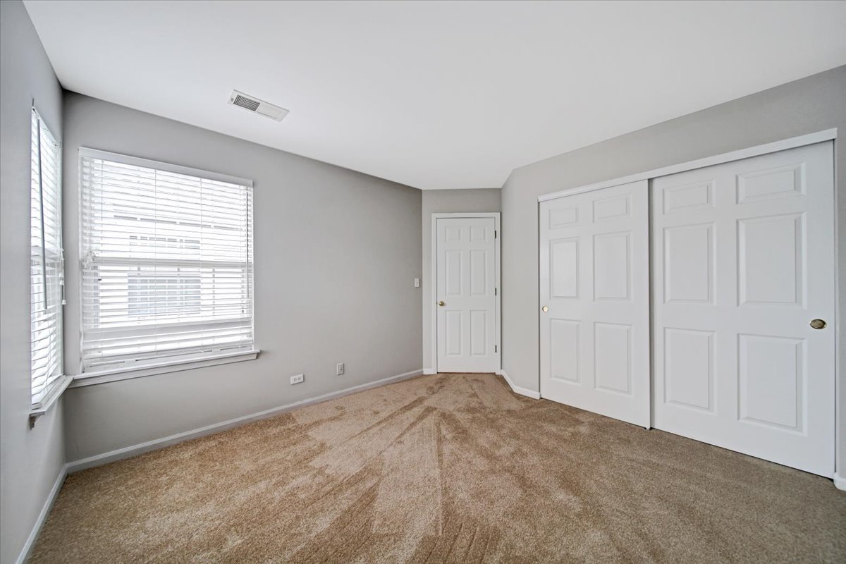 351 Fallbrook Court Schaumburg, IL 60107 - Photo 14 of 29 a view of an empty room with a window