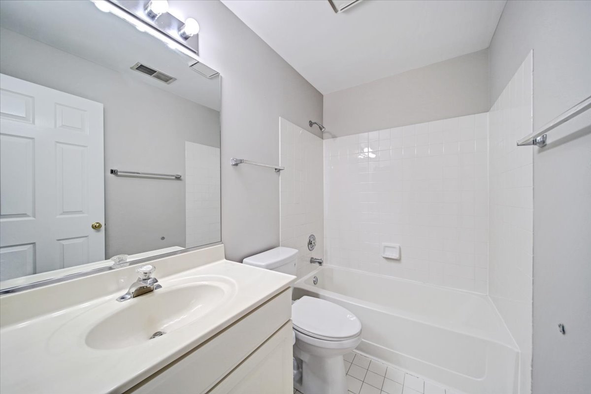 351 Fallbrook Court Schaumburg, IL 60107 - Photo 15 of 29 a bathroom with a sink toilet and shower