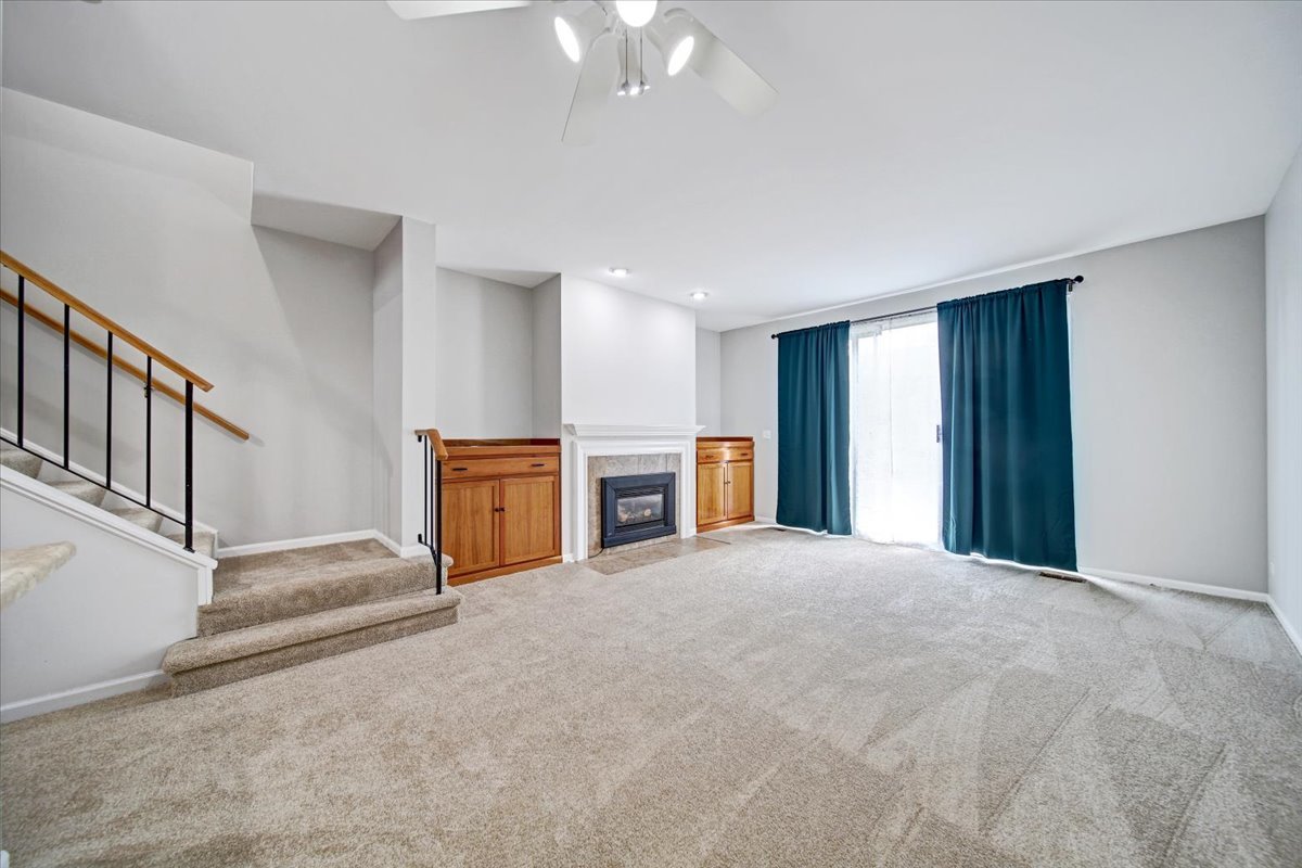 351 Fallbrook Court Schaumburg, IL 60107 - Photo 18 of 29 a view of a livingroom with a staircase