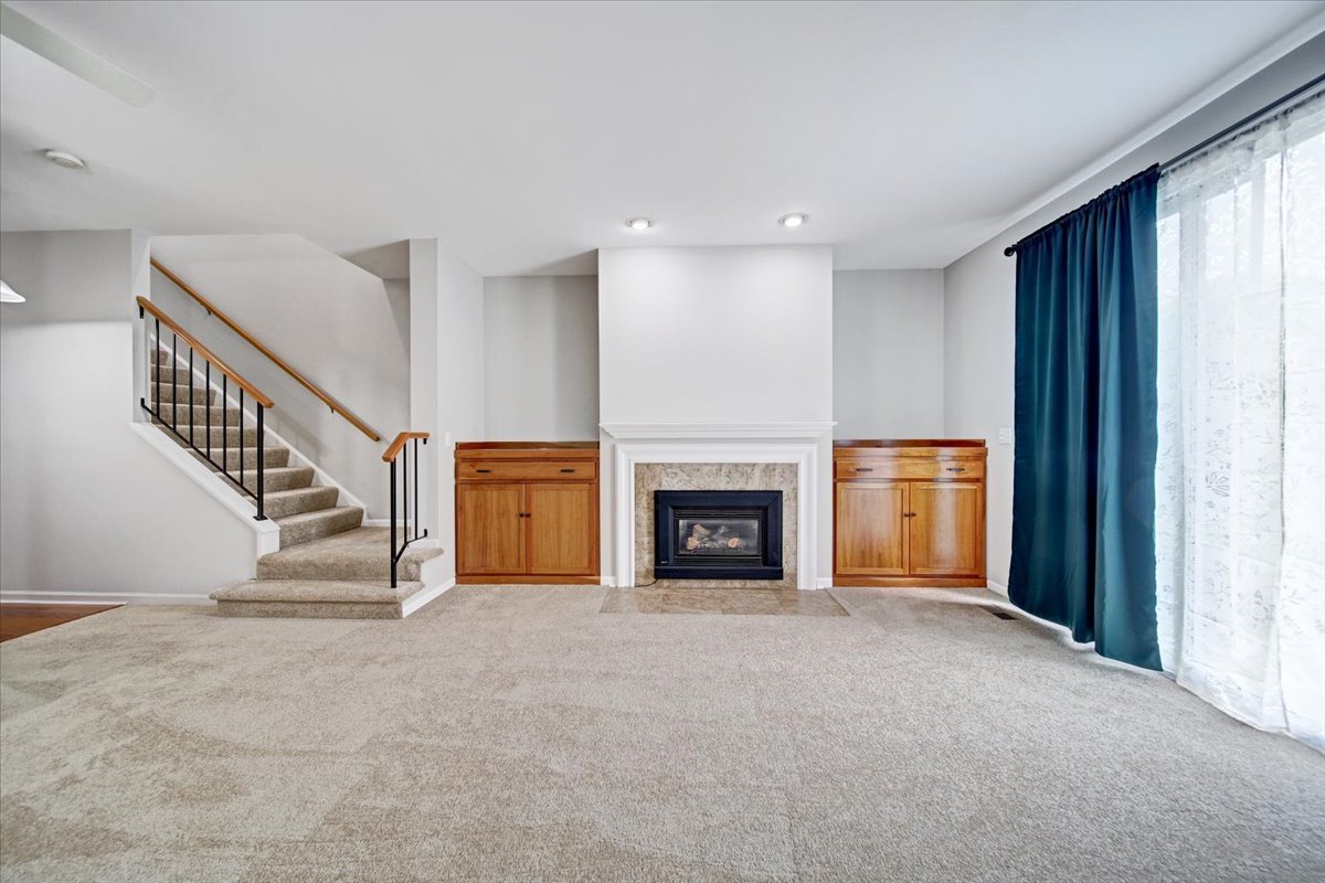 351 Fallbrook Court Schaumburg, IL 60107 - Photo 19 of 29 a view of a livingroom with an empty space and a fireplace