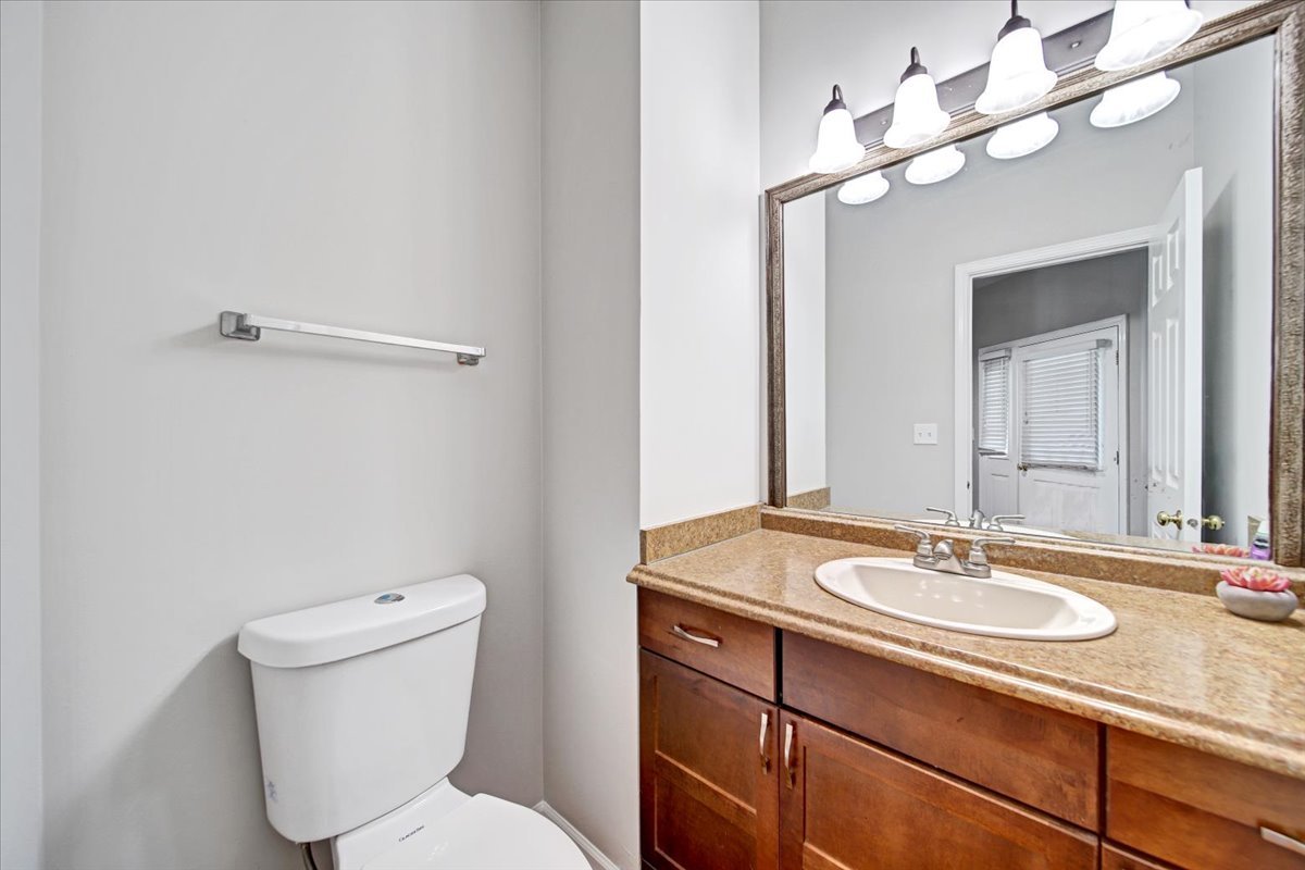 351 Fallbrook Court Schaumburg, IL 60107 - Photo 25 of 29 a bathroom with a toilet sink and mirror