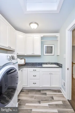 a view of a kitchen with furniture and window