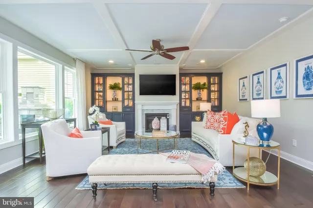 a very nice looking dining room with furniture and a chandelier