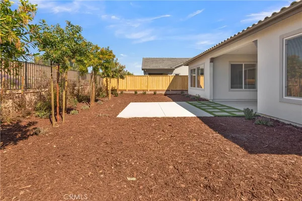 a view of a backyard with large trees