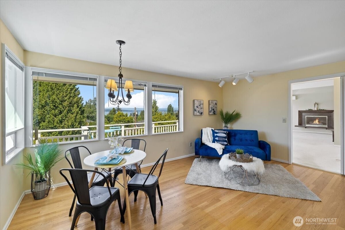 2606 49th Place Southwest Everett, WA 98203 - Photo 7 of 37 a living room with furniture and a chandelier