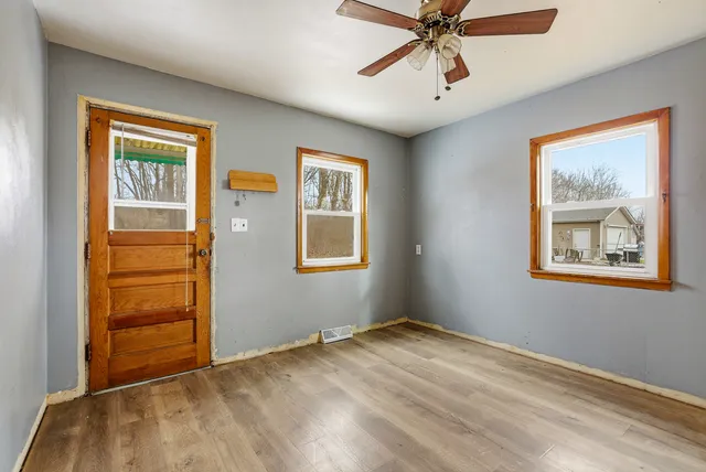 a view of an empty room with a window