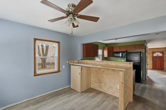 a kitchen with stainless steel appliances granite countertop a stove and a refrigerator