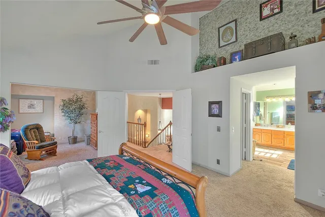 a bedroom with furniture and a window
