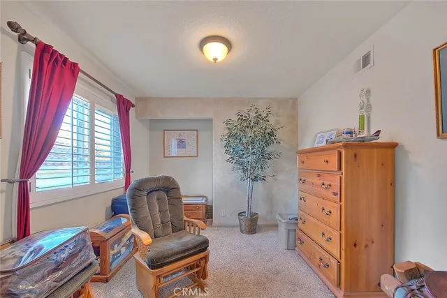 a bedroom with furniture and a chandelier