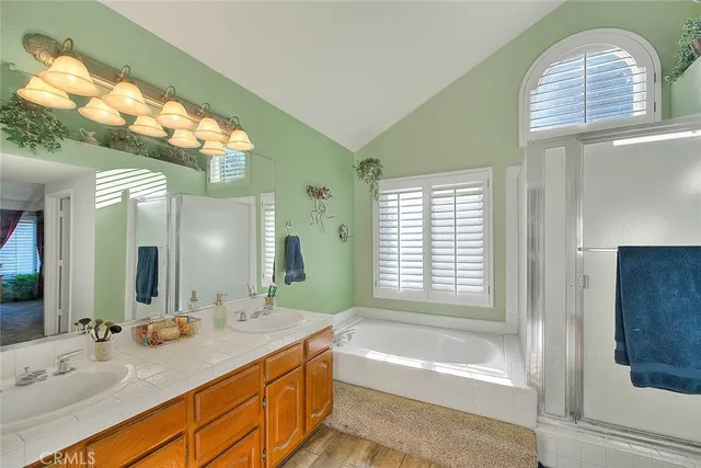 a bathroom with a sink a mirror and a bathtub