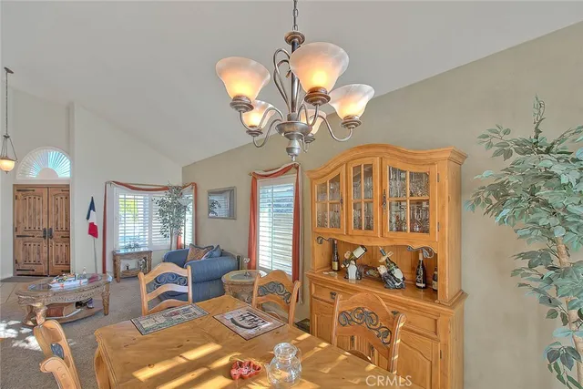 a view of a livingroom with furniture and a large window