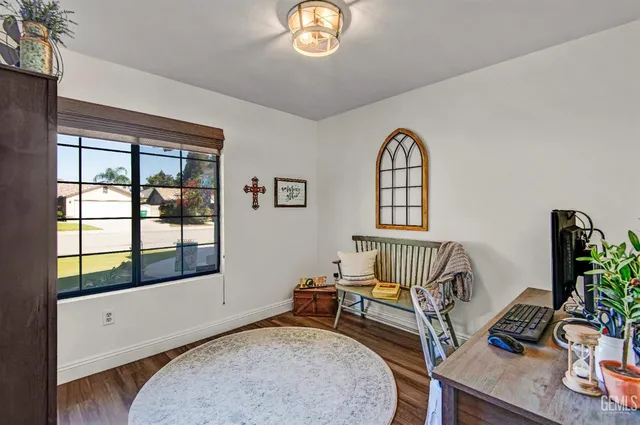a bedroom with furniture and a window