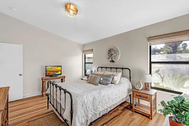 a bedroom with bed and a window