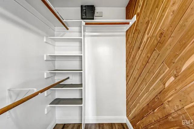 a view of staircase with white walls and a window