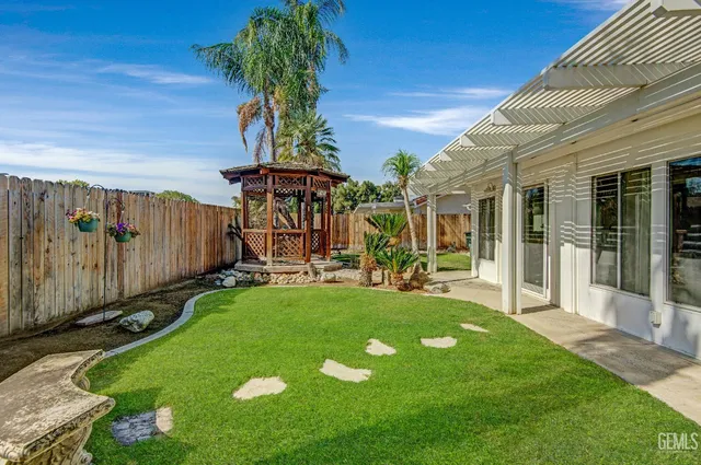 a view of a backyard with patio