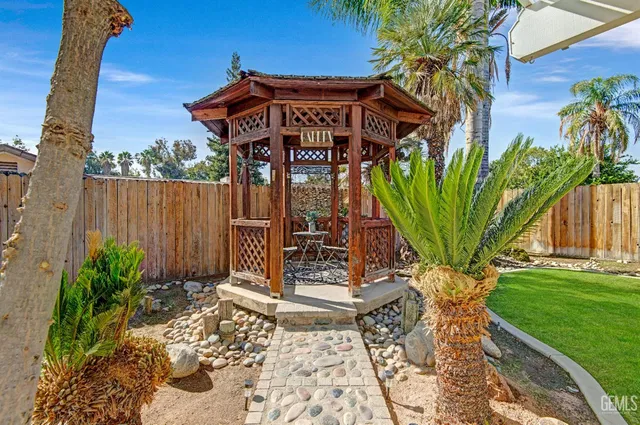 a view of a wooden door with a bench