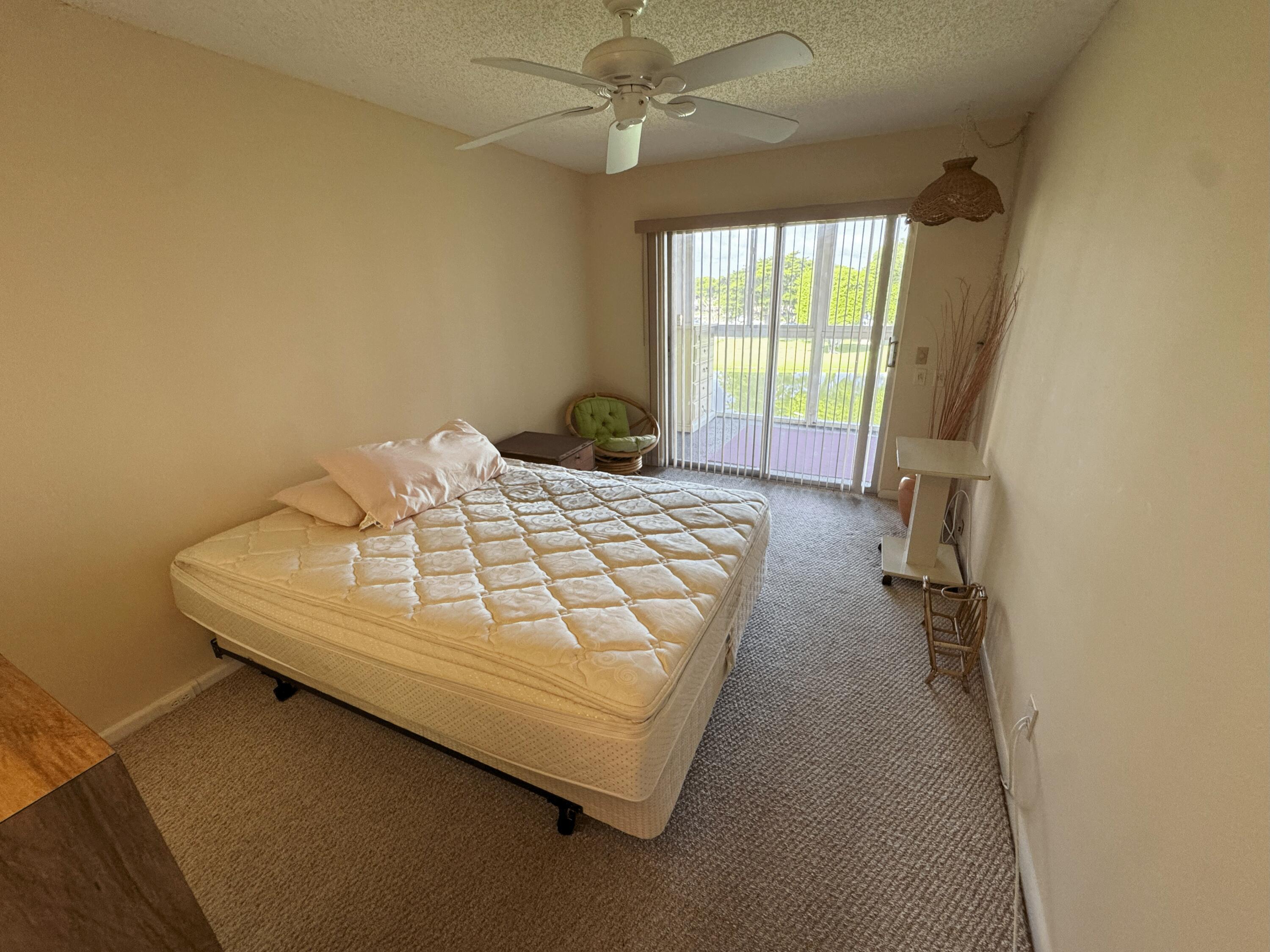 4075 Cornwall East Boca Raton, FL 33434 - Photo 10 of 30 a bedroom with a bed and a window