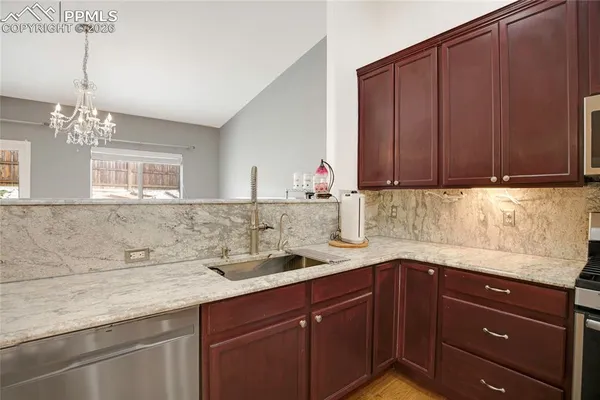 a kitchen with a sink and cabinets