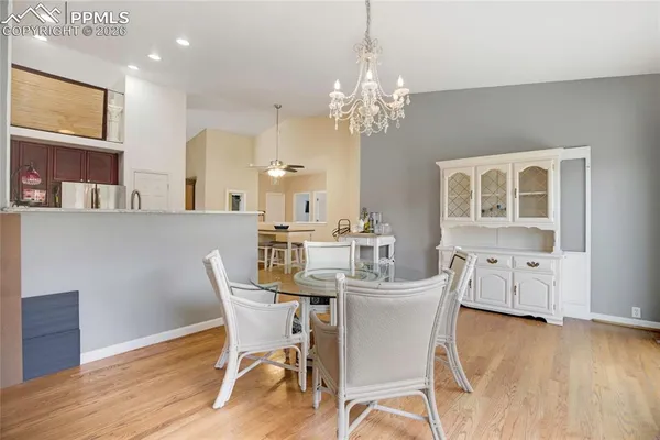 a dining room with furniture and chandelier