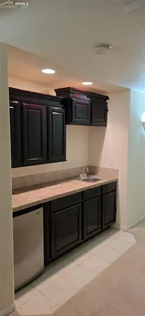 a bathroom with a sink and a large mirror