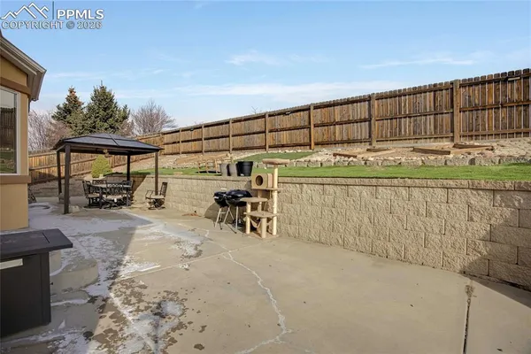a view of a backyard with furniture