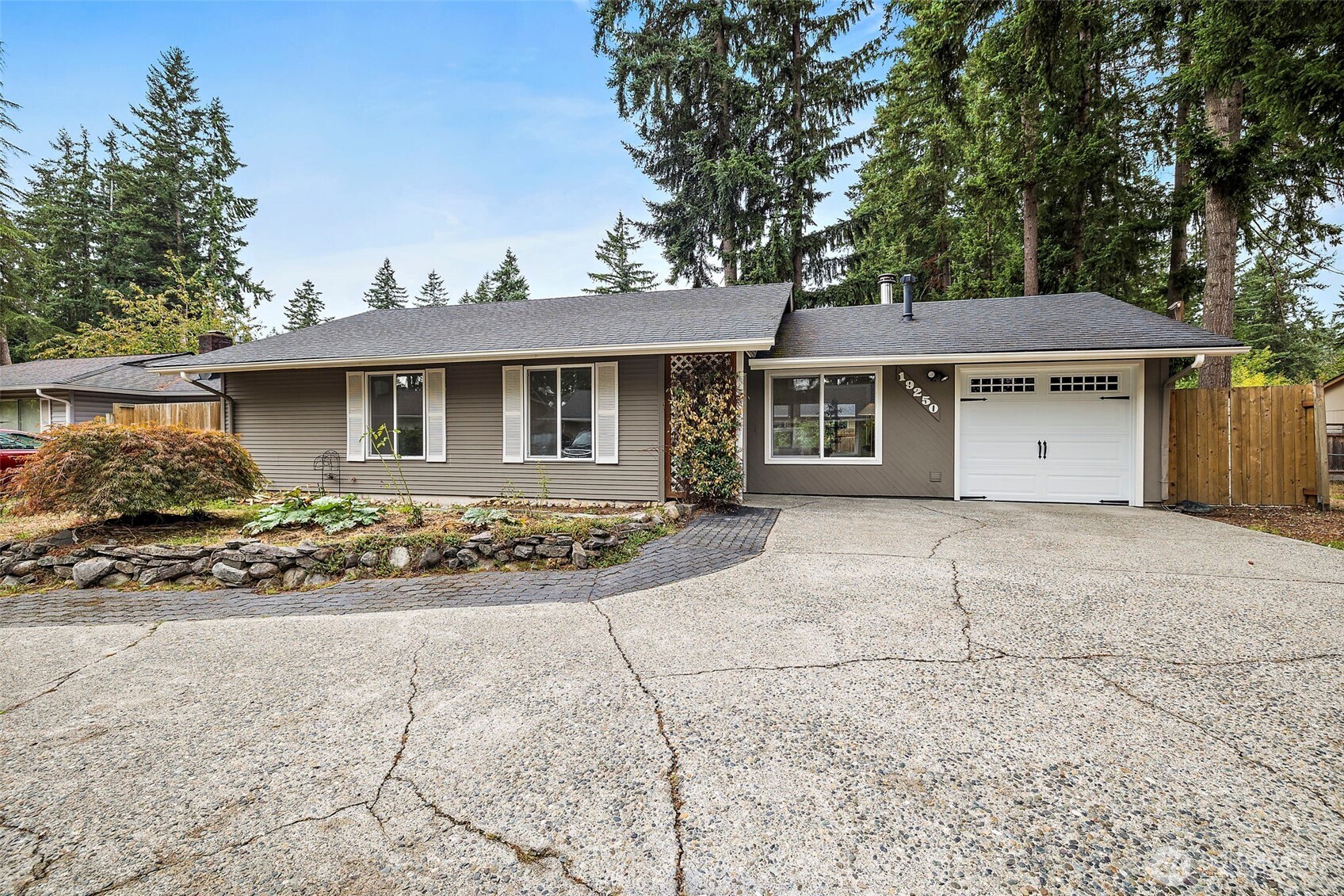 19250 Southeast 268th Street Covington, WA 98042 - Photo 30 of 37 a front view of a house with a garden