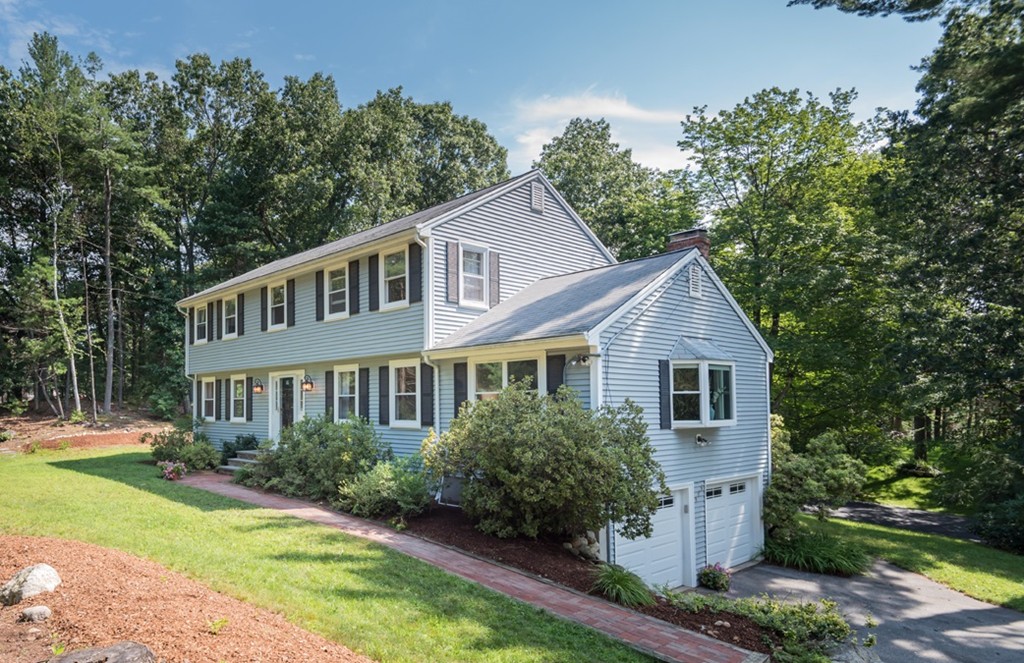 125 Rattlesnake Hill Road Andover, MA 01810 - Photo 1 of 28 a front view of a house with a yard