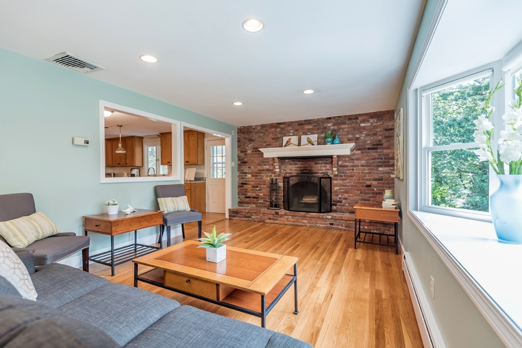 125 Rattlesnake Hill Road Andover, MA 01810 - Photo 12 of 28 a living room with furniture and a fireplace