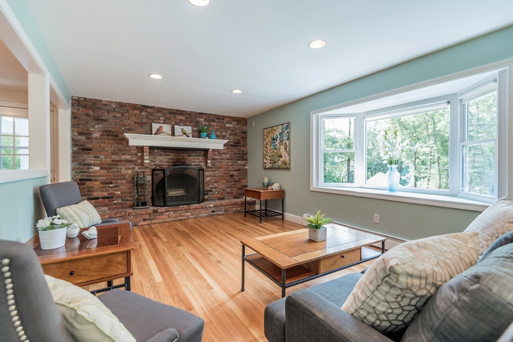 125 Rattlesnake Hill Road Andover, MA 01810 - Photo 13 of 28 a living room with furniture and a fireplace