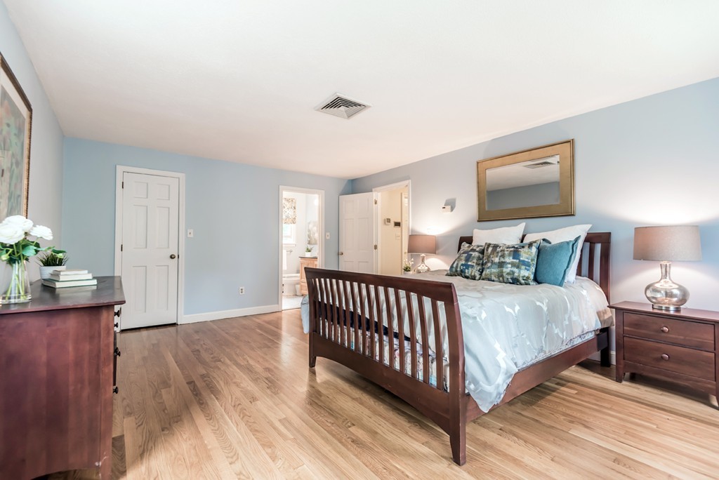 125 Rattlesnake Hill Road Andover, MA 01810 - Photo 18 of 28 a spacious bedroom with a bed and a window