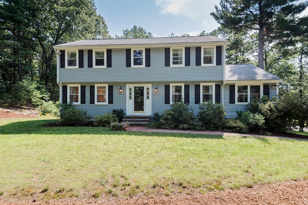125 Rattlesnake Hill Road Andover, MA 01810 - Photo 2 of 28 a front view of a house with a yard
