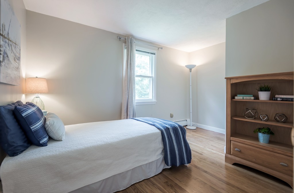 125 Rattlesnake Hill Road Andover, MA 01810 - Photo 22 of 28 a bedroom with a bed and closet with window