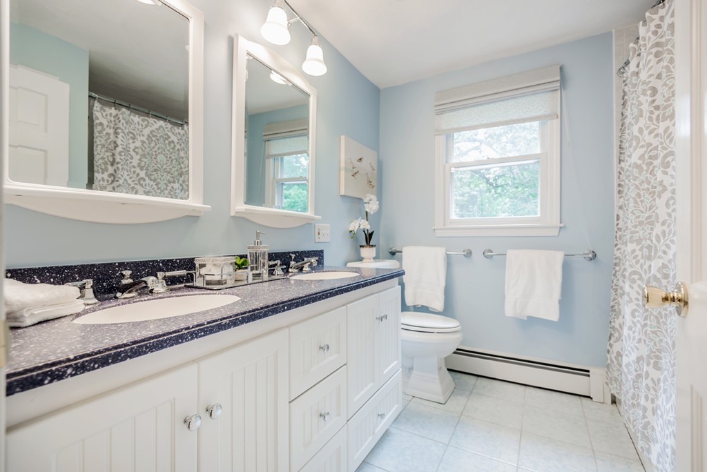 125 Rattlesnake Hill Road Andover, MA 01810 - Photo 23 of 28 a bathroom with a granite countertop sink toilet and mirror