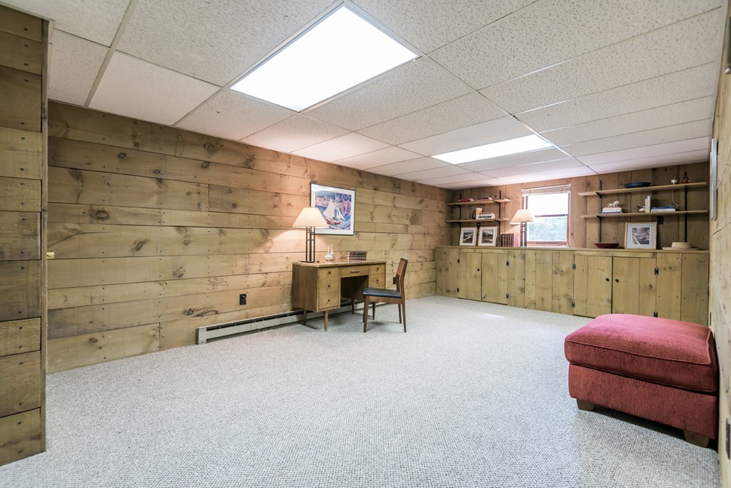 125 Rattlesnake Hill Road Andover, MA 01810 - Photo 24 of 28 a room with furniture and a wooden floor