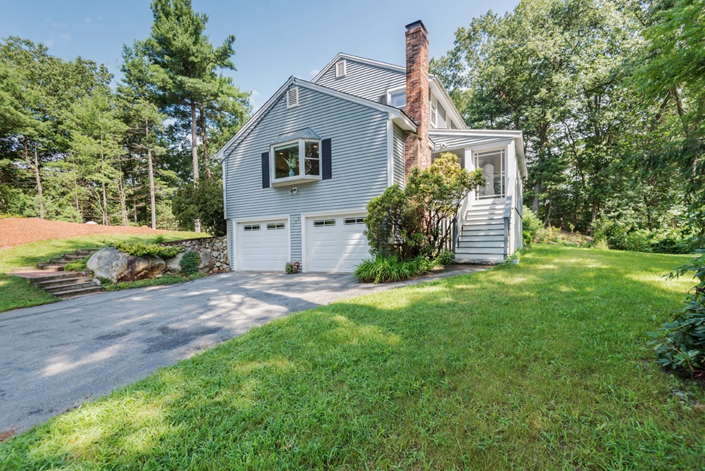 125 Rattlesnake Hill Road Andover, MA 01810 - Photo 27 of 28 a view of a house with backyard and garden
