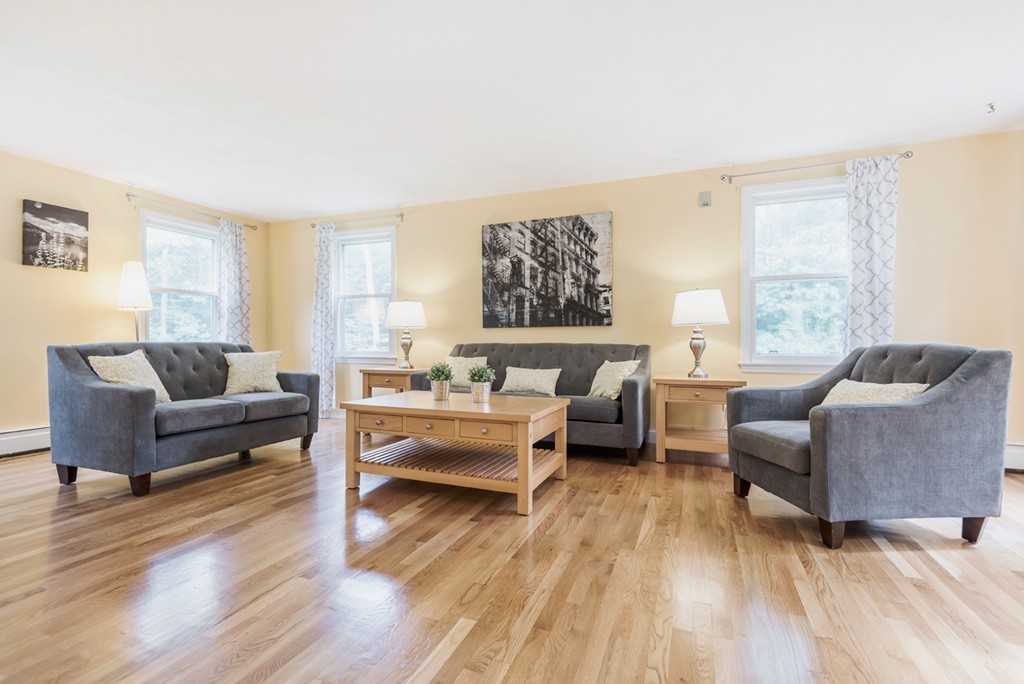 125 Rattlesnake Hill Road Andover, MA 01810 - Photo 4 of 28 a living room with furniture and a wooden floor