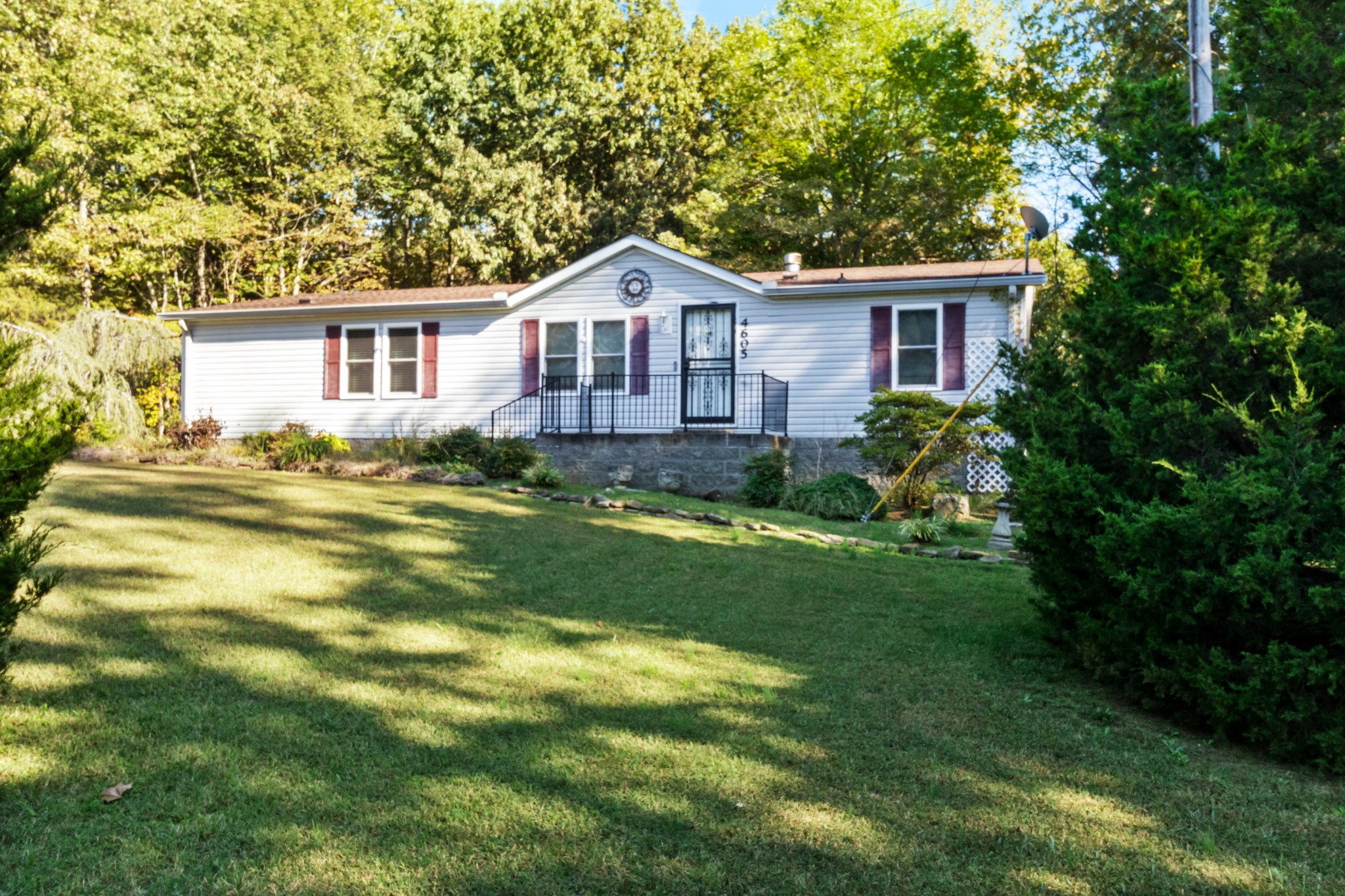 4605 Marion Road Cunningham, TN 37052 - Photo 1 of 45 a front view of a house with a garden
