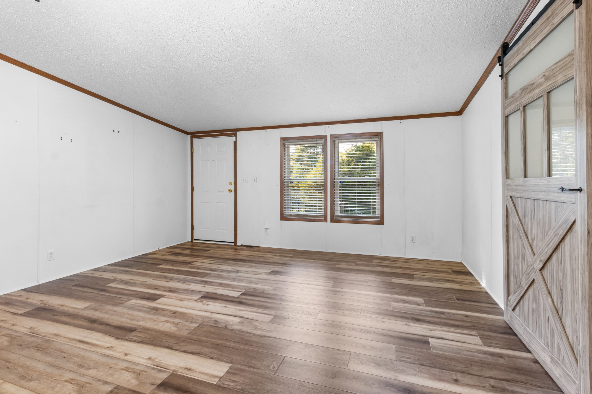 4605 Marion Road Cunningham, TN 37052 - Photo 18 of 45 a view of an empty room with a window and wooden floor