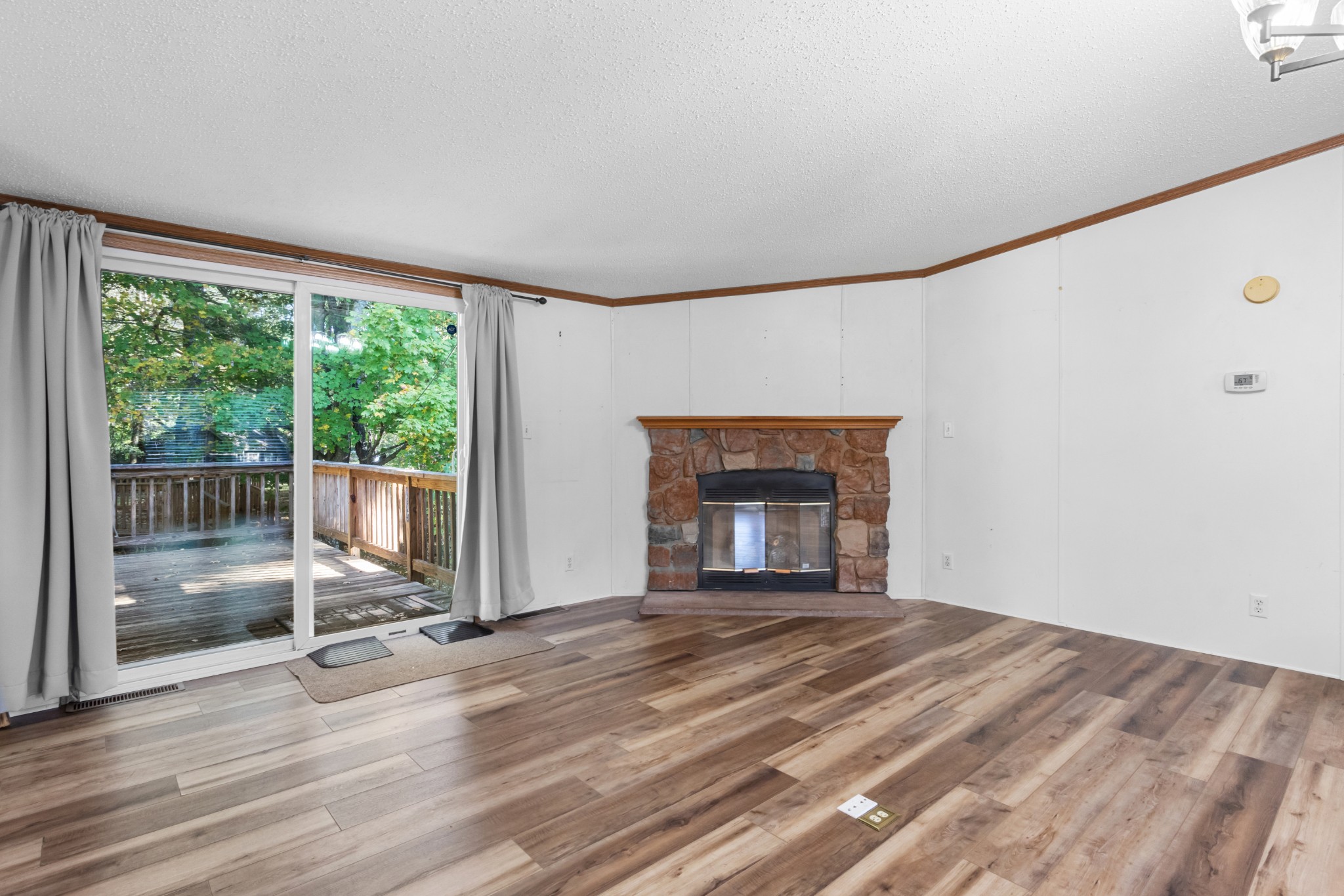 4605 Marion Road Cunningham, TN 37052 - Photo 19 of 45 a view of empty room with wooden floor and fireplace