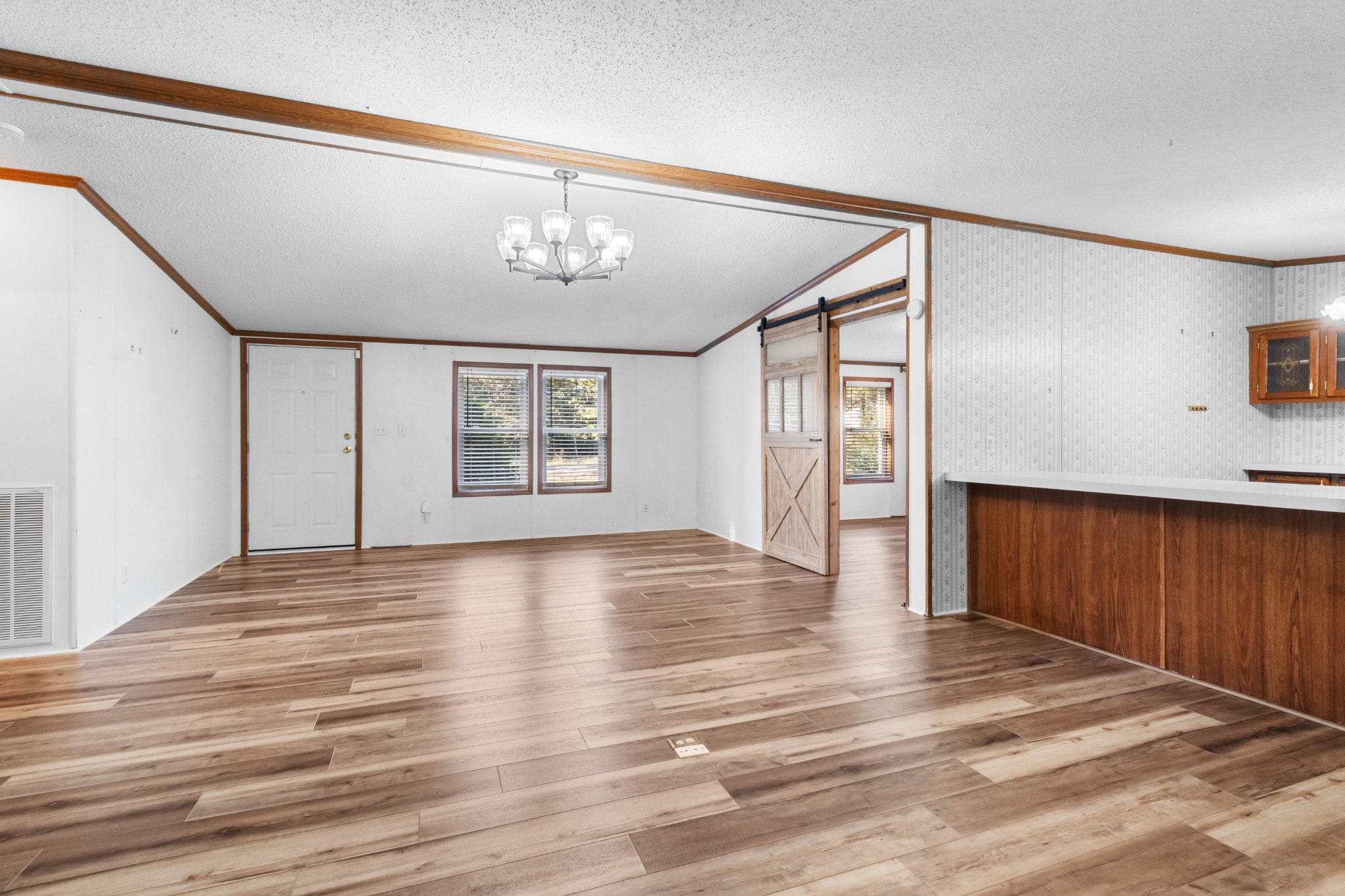 4605 Marion Road Cunningham, TN 37052 - Photo 20 of 45 a view of an empty room with wooden floor and a window