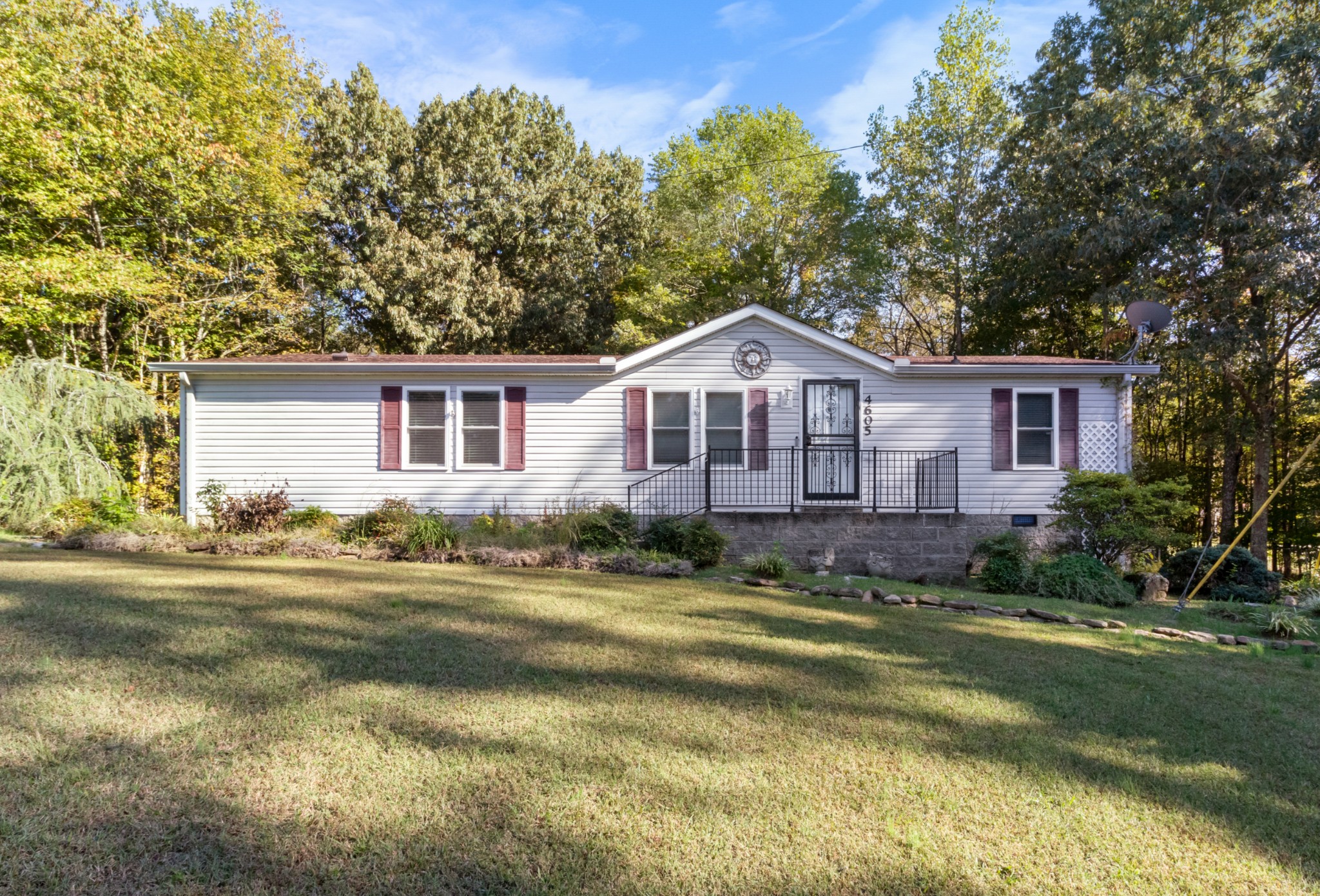 4605 Marion Road Cunningham, TN 37052 - Photo 2 of 45 a view of a house with a big yard and large trees