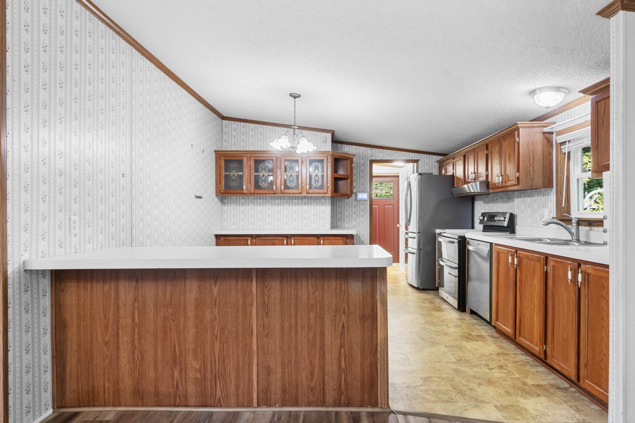 4605 Marion Road Cunningham, TN 37052 - Photo 22 of 45 a kitchen with stainless steel appliances granite countertop a refrigerator and a stove top oven