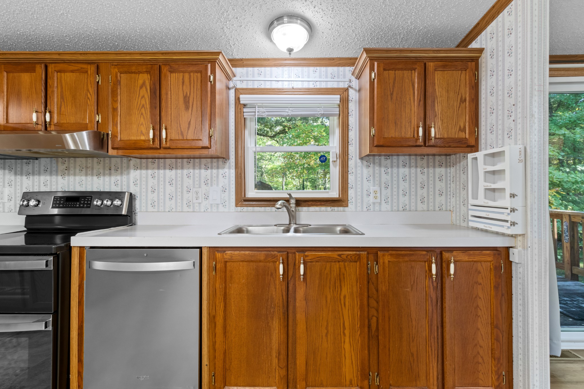 4605 Marion Road Cunningham, TN 37052 - Photo 24 of 45 a kitchen with granite countertop a sink window and cabinets