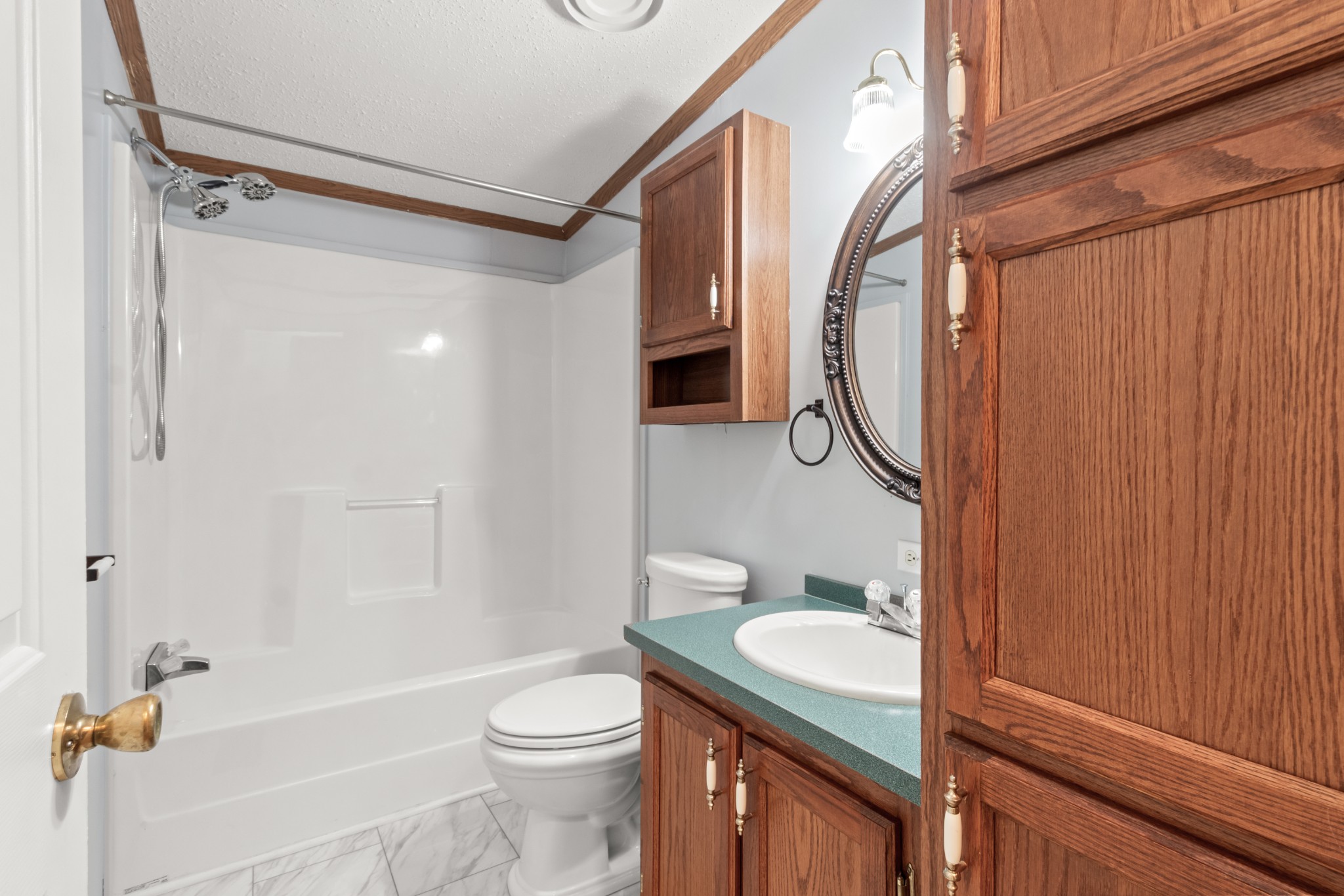 4605 Marion Road Cunningham, TN 37052 - Photo 29 of 45 a bathroom with a granite countertop sink toilet and shower