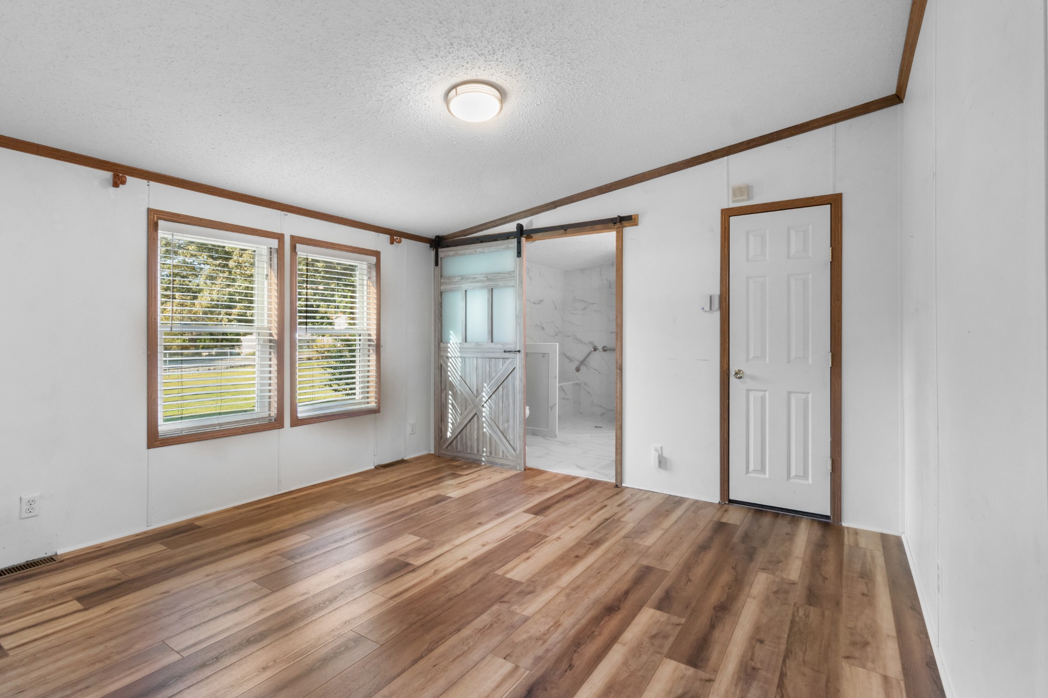 4605 Marion Road Cunningham, TN 37052 - Photo 32 of 45 a view of empty room with wooden floor and fan