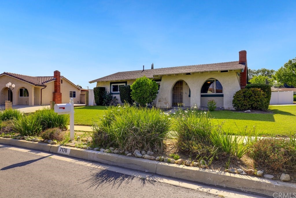 7176 Teak Way Rancho Cucamonga, CA 91701 - Photo 1 of 1 a front view of a house with garden